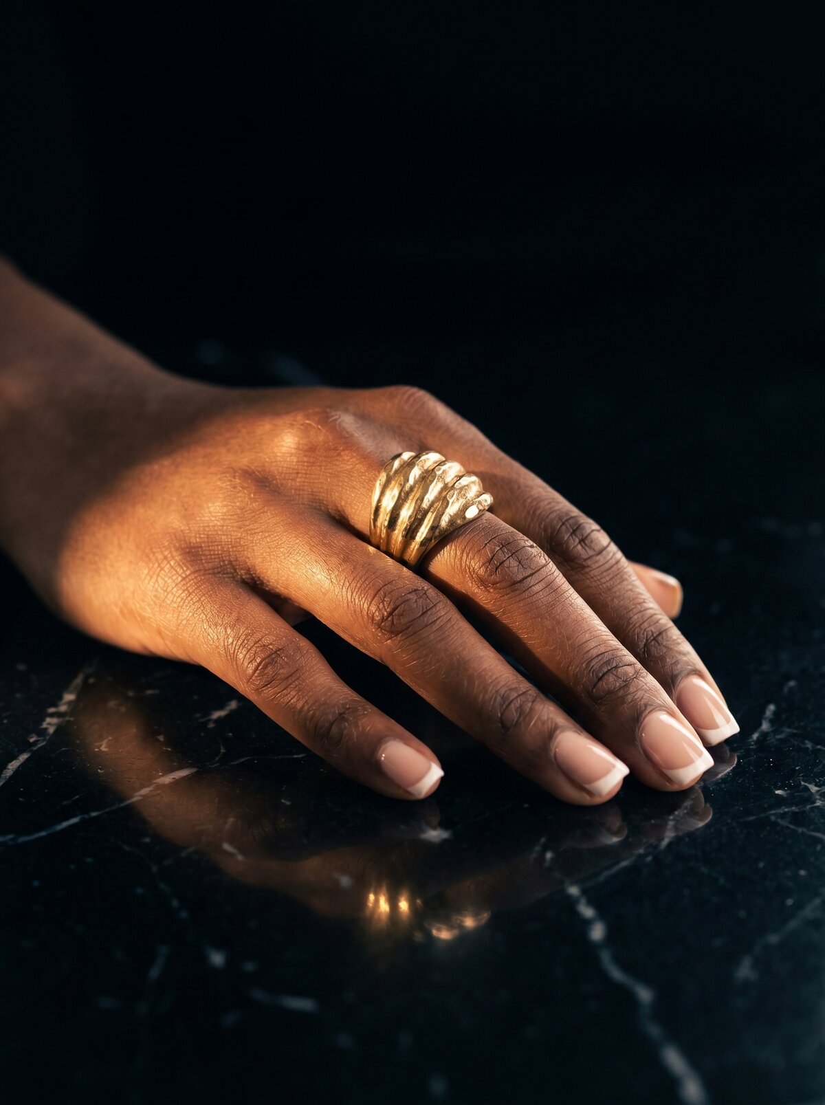 Gilded, hand detail with rings
