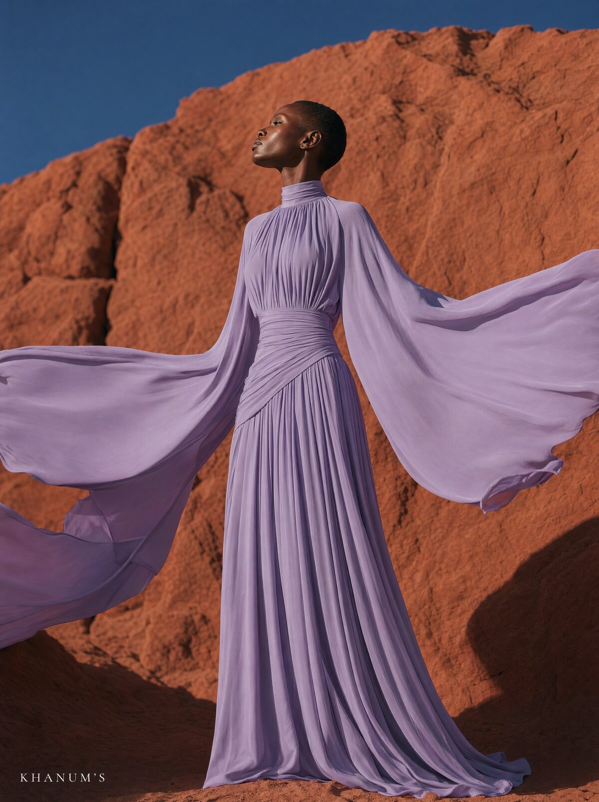 Khanum's, lavender gown, back view among rocks